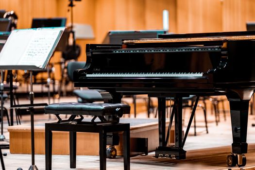a piano on the Philharmonic stage among other musical instruments.