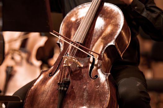 cello on the stage of the Philharmonic during a concert.