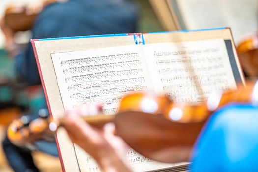 a violinist plays at a concert in the Philharmonic.