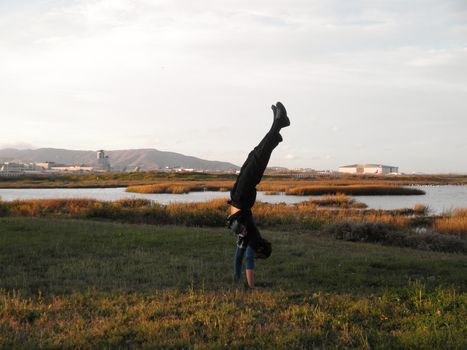 Handstanding Marshes outside of SFO Airport in San Francisco, California.