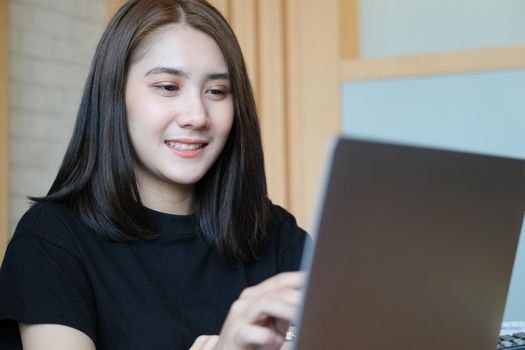 digital technology with Business woman using computer laptop to trade charts to find buy and sell points for her port.