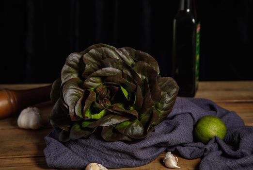 Bunch of fresh lettuce leaves on a dark background. Close-up.