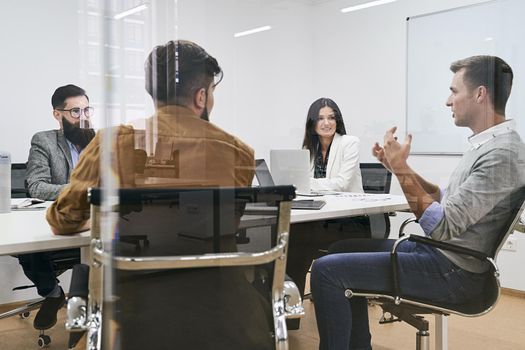 Corporate business team and manager in a meeting at IT company office