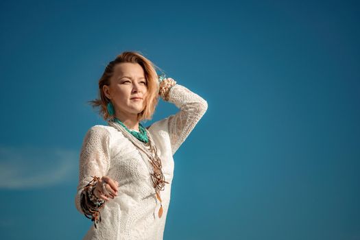 fashionable young model in boho style dress