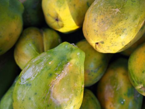 Hawaiian papaya pile at a farmer's market in Hawaii 