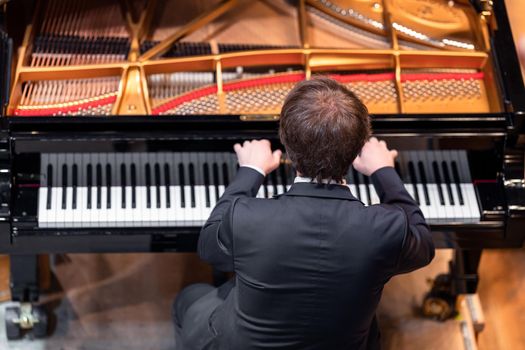 a piano on the Philharmonic stage among other musical instruments.