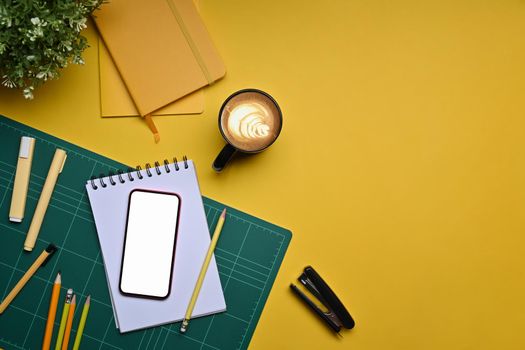 Mock up smart phone, coffee cup and stationery on yellow background.