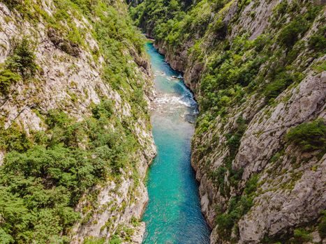 The purest waters of the turquoise color of the river Moraca flowing among the canyons. Travel around Montenegro concept.