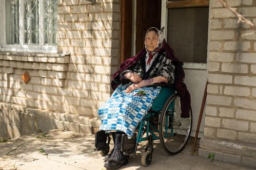 very old woman in a wheelchair.