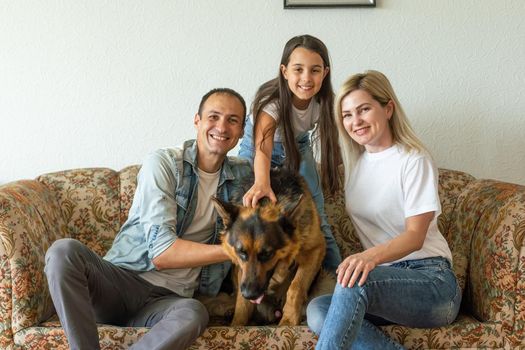 german shepherd and family. German shepherd is the best friend of the child