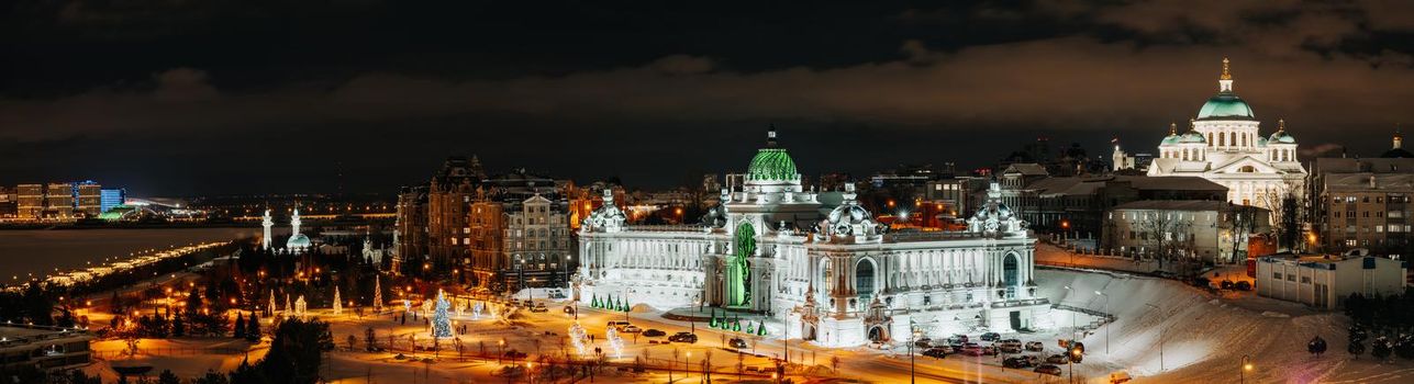 Panorama of Kazan, Tatarstan, Russia. Amazing night view of beautiful winter embankment, Farmers Palace (Ministry of Environment and Agriculture) Kazan city center near Kremlin. Landmark place Kazan