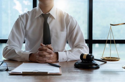 Close up business lawyer man reaching out sheet with contract agreement proposing to sign.Full and accurate details, individual who owns the business sign personally,director of the company, solicitor