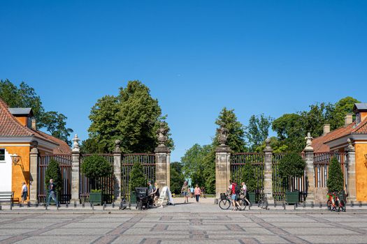 Copenhagen, Denmark - July 12, 2022: People at the main entrance to Frederiksberg Gardens.