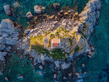 Sveta Nedelja is an islet on the Adriatic Sea, in Montenegrin municipality of Budva. It is located opposite the town of Petrovac na Moru in Montenegro. It has a small church on it.