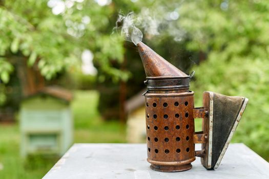 Smoke canister to scare away bees on a honey farm