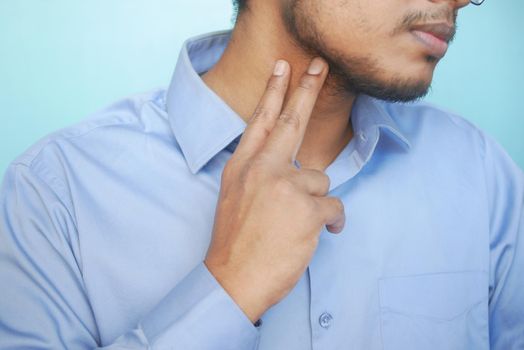 Unrecognized Man Touching His Neck To Control Blood Pressure .