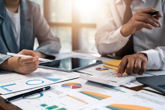 Asian business adviser meeting to analyze and discuss the situation on the financial report in the meeting room.Investment Consultant, Financial advisor and accounting concept.