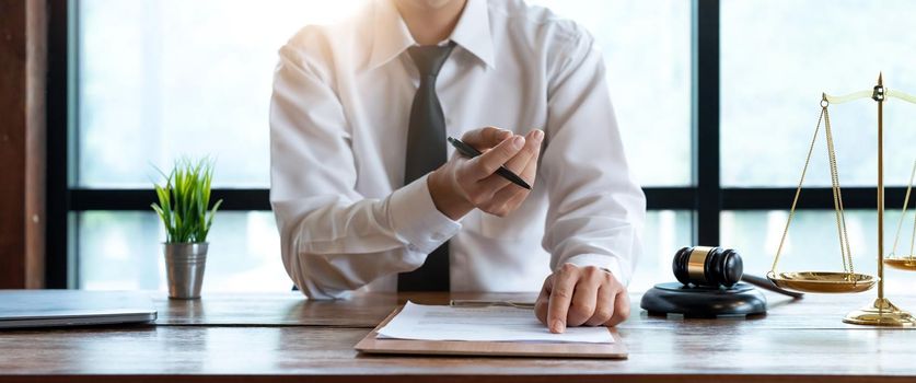 Close up business lawyer man reaching out sheet with contract agreement proposing to sign.Full and accurate details, individual who owns the business sign personally,director of the company, solicitor