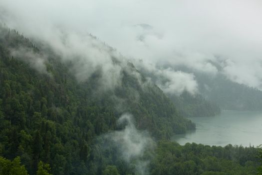 Mountain lake in the fog.