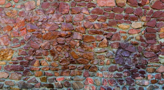 A wall of red, purple stone.