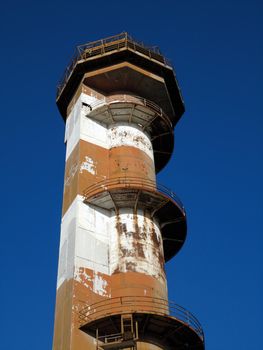 Close-up of top section of Historic Ford Island aviation control tower at Pearl Harbor Hawaii, which is showing signs of age with rust and chipping paint. The Air Traffic Control Tower is considered a great monument to this era and the vital service it provided.