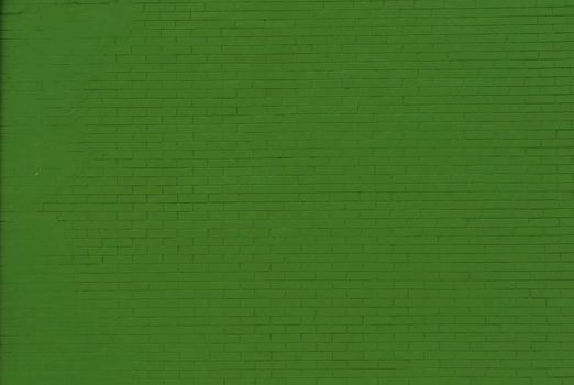 Panoramic solid old green brick wall.