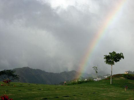 Rainbow over the National Memorial Cemetery of the Pacific in Punchbowl on Oahu, Hawaii.