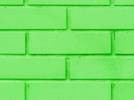 Fragment of a green brick wall close-up.....