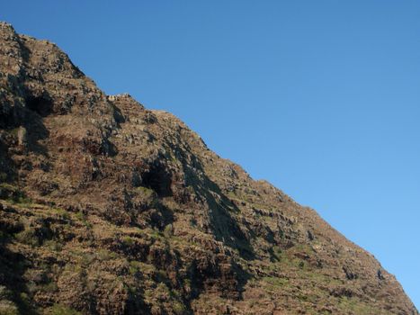 Close-up of top corner area of Koʻolau Range. Koʻolau Range is a name given to the fragmented remnant of the eastern or windward shield volcano of the Hawaiian island of Oʻahu.