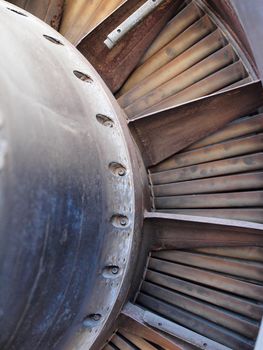 Close up of turbine and fan blades of a jet engine with signs of wear such as spots and rust.