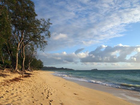 Gentle waves crash on Waimanalo Beach on Oahu, Hawaii.  Looking north towards Lanikai.