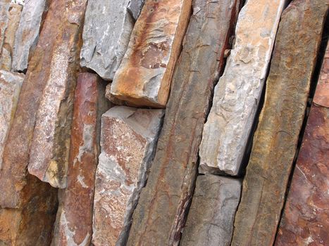 brick Stone cut wall of gray, red, and orange.