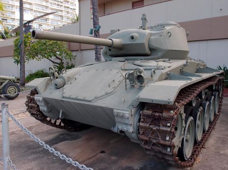 US Light Tank, M24 on Display at the Army Museum in Waikiki, Hawaii.  The M24 was used for scouting and reconnaissance in the late days of WWII.  It mounted a 75mm main gun and three machine guns behind 1' of armor.  Two cadillac V-8 engines Drove the 19 ton tank and its crew of four at speeds of up to 35 mph.