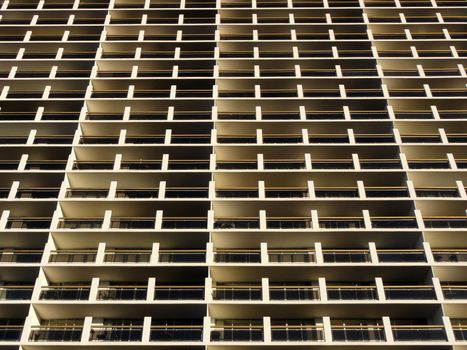 Balconies and Windows of Building looking upwards creating a pattern in Oakland, California.                               