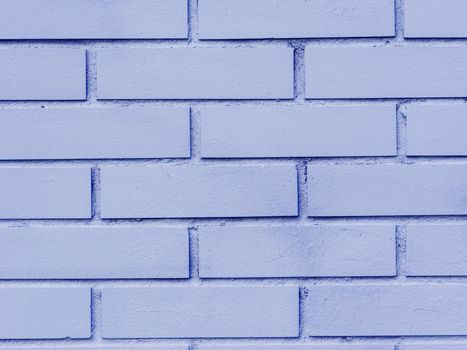 Fragment of a blue brick wall close-up.