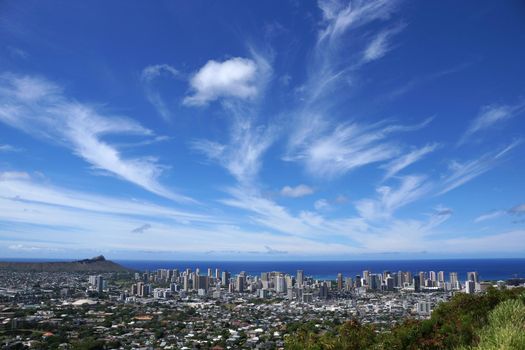 Diamondhead and the city of Honolulu on Oahu on a nice day. UH Manoa, Waikiki, Kahala, H-1 Highway, and amazing clouds visible, seen from Round Top Dr. lookout point.  July 2014.
