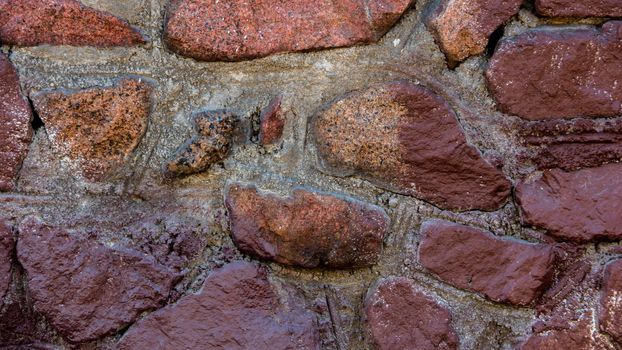 Abstract background of a multi-colored stone wall