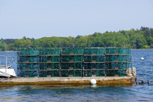 Lobster traps at a fishing pier on Littlejohn Island, Yarmouth, Maine, New England.
