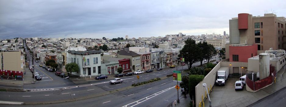 San Francisco Geary Street Cityscape Panorama with buildings, cars, and road on a foggy day in California.