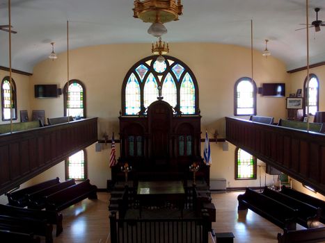 Inside Maine Jewish Museum - Historic Etz Chaim Synagogue built in the 1920's with stain glass shining light into the room.  Portland, Maine.