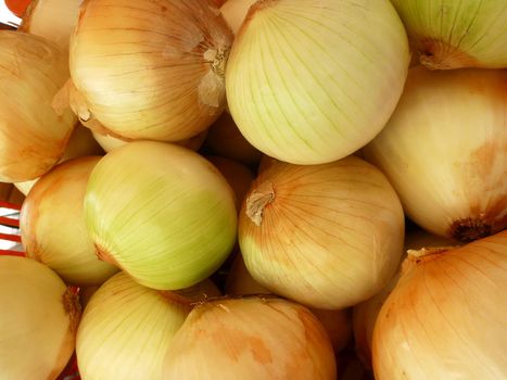 Pile of Fresh Onions for sale at Market.