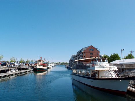 Boats Docked at piers in Portland Harbor, Maine on a beautiful day.