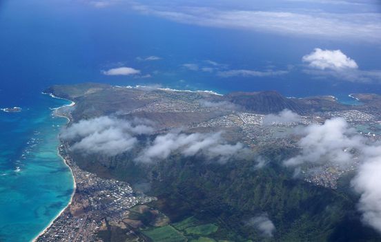 Aerial view of Waimanalo, Rock Island, Hawaii Kai Town, Koko Head Crater, farms, ko'olau range mountains, Kuapa Pond, Hanauma Bay, clouds and Pacific Ocean on Oahu, Hawaii.  On a spectacular day.