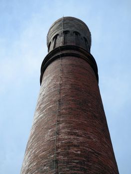 Historic Stream tower at Waterworks building against a blue sky in Boston.                               
