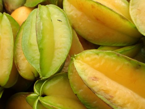 pile of Starfruit on sell at farmers market in Maui