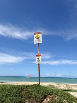 Dangerous shore break and Steep cliff Warning Signs at Baldwin Beach Maui.