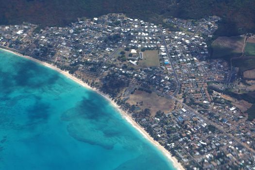 Aerial view of Waimanalo Beach, Homes, bay. Highway, Park, farms, and  Pacific Ocean on Oahu, Hawaii.