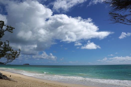 Gentle wave lap on Waimanalo Beach looking towards Mokulua islands on a nice day Oahu, Hawaii. July 2014.