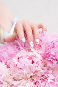 bride in a blue wedding dress with a bouquet of pink peonies, pastel paradise, floral background, complementary color combination. High quality photo