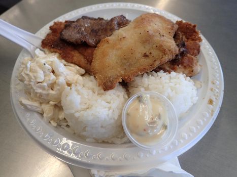 MIX PLATE - BBQ Beef, Mahi, Boneless Chicken plus two scoops rice and one scoop macaroni salad.